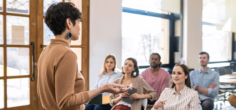 students listen as an instructor discusses materials