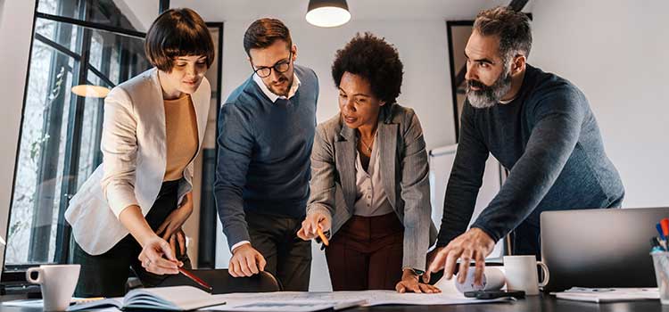 business team reviews strategy in modern office