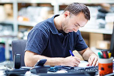 accountant working in warehouse