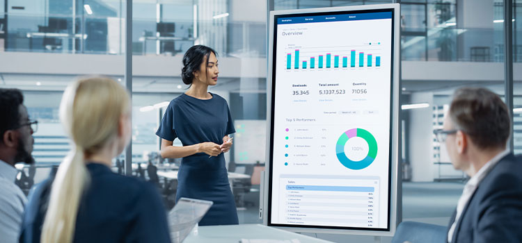 A woman discusses a presentation on marketing performance