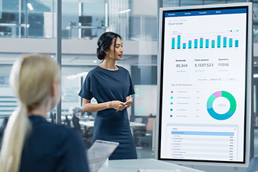 woman presents marketing plan