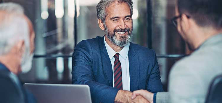 businessman shaking hands with client