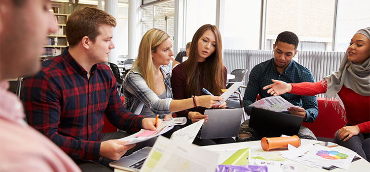 Students study around a table