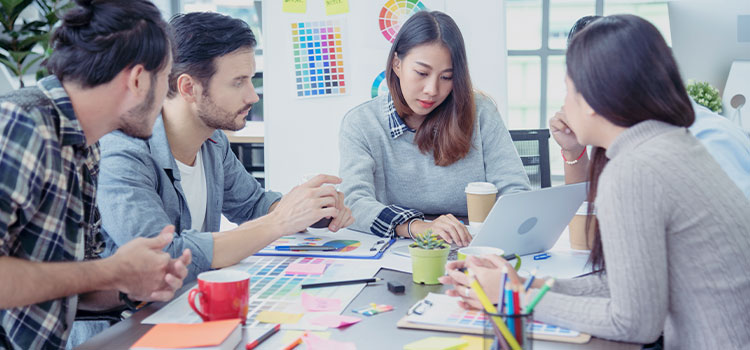 A team working on  a project discusses information