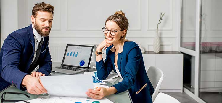 marketing managers review campaign results together