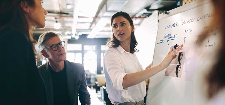 marketing manager in georgia presents summer beauty campaign plan to team