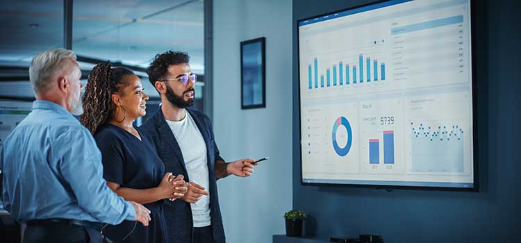 marketing manager reviews campaign stats with clients